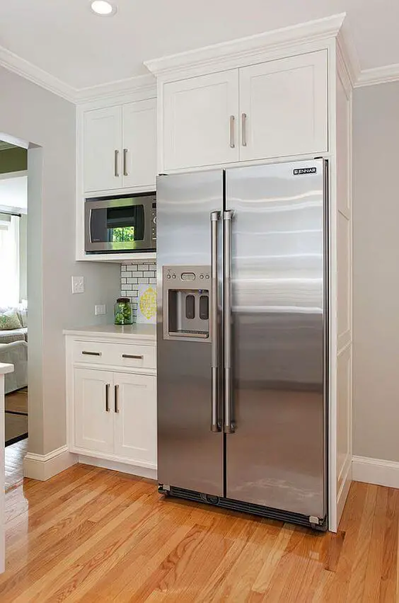 As you can see, it isn’t too hard to fit cabinets around the refrigerator in an efficient way! More decor and other interesting ideas at betterthathome.com