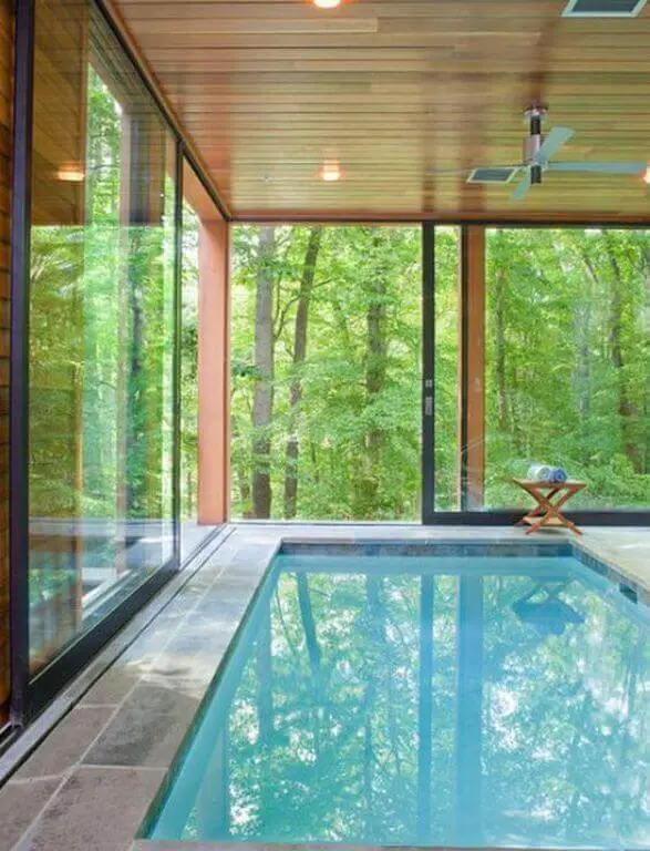 With a big indoor swimming pool you can enjoy it all year round, even when it’s cold and rainy outside, or you want to go for a midnight swim under a blanket of stars. For more pools designs go to betterthathome.com