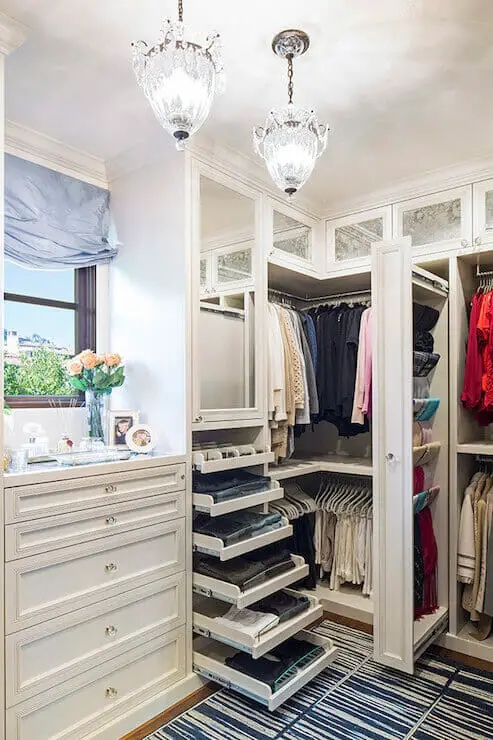 Photo of a luxurious closet design with a window.