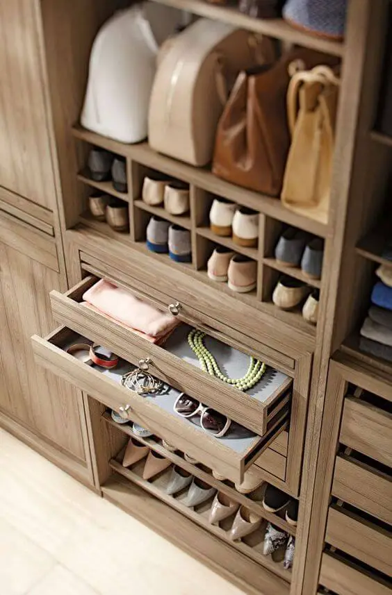 Photo of a luxurious closet design with storage for accessories.