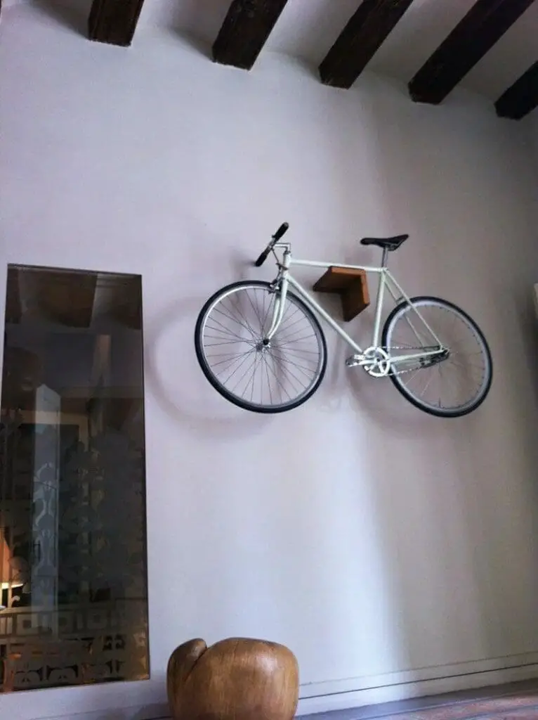 Photo of a bicycle on the wall.