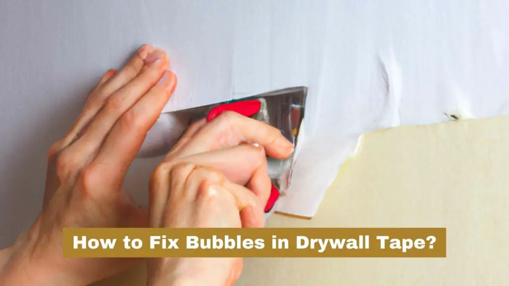 A Person's hand repairing bubbles in drywall tape. How to Fix Bubbles in Drywall Tape?