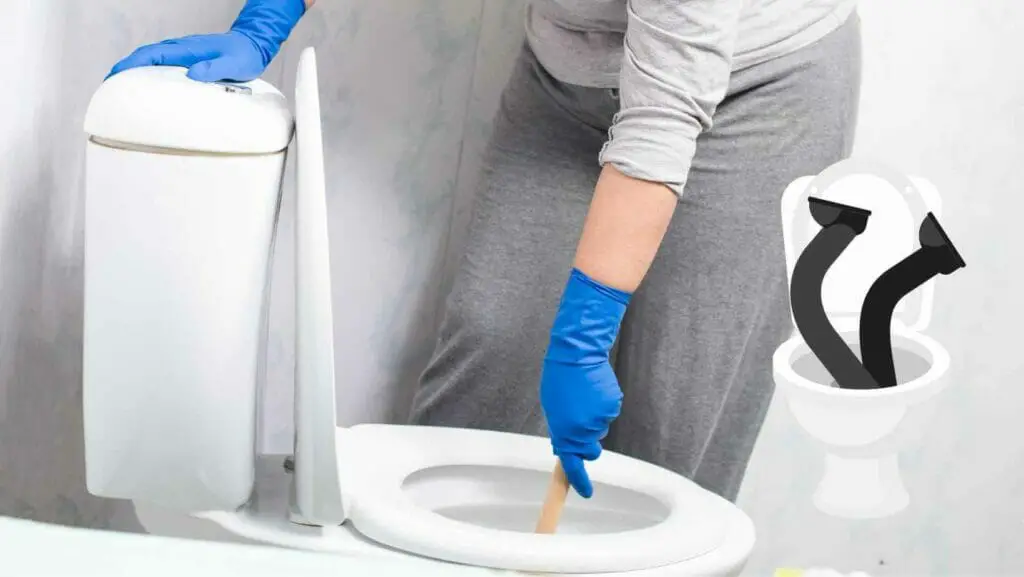 Photo of a person with a plunger remove an object stuck in the toilet. How to remove object stuck in toilet?